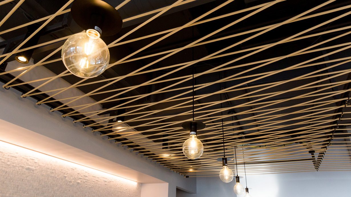 Architectural details add texture to the ceiling.