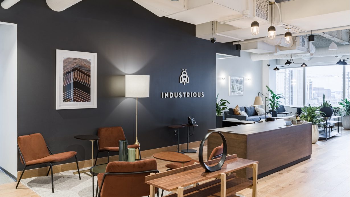 Common spaces feature sleek wood furnishings and tons of natural light.