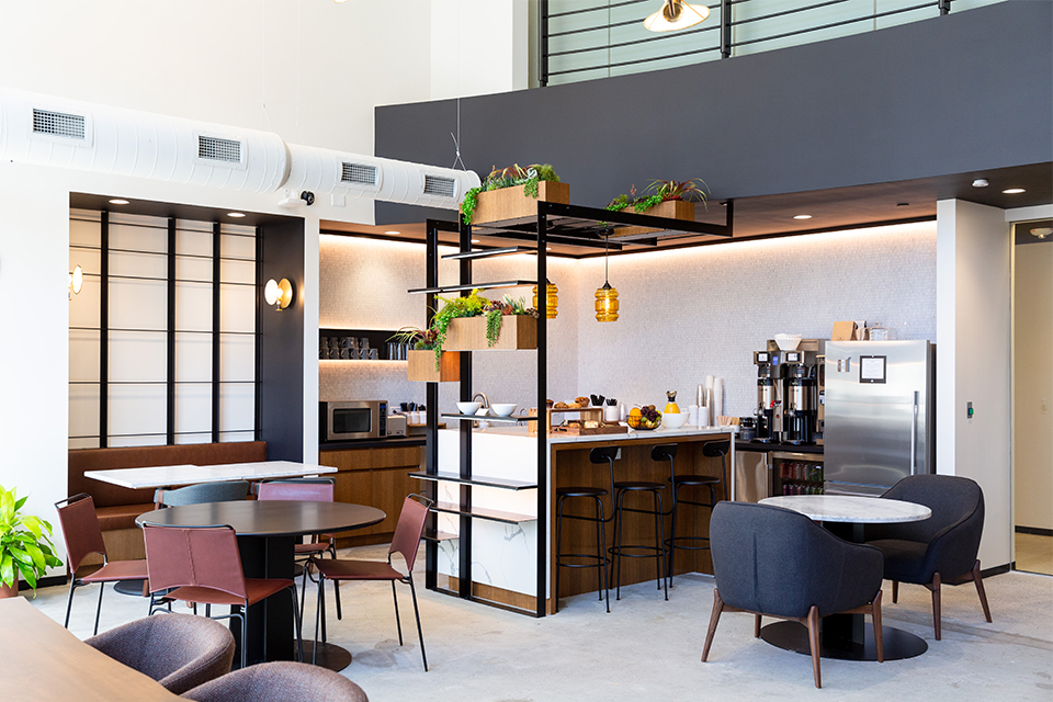 Common areas contain greenery and plenty of seating options so members can unwind or focus.