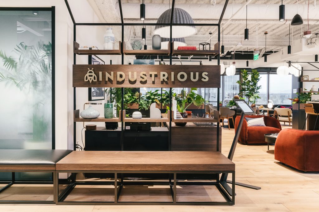A warm and inviting reception area greets members and visitors at Seattle’s Industrious Bellevue.