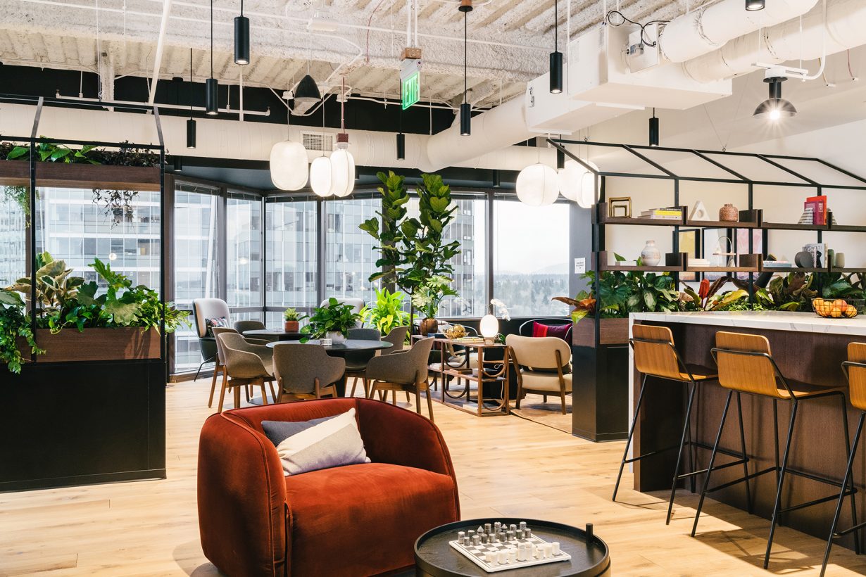 Common areas filled with lush greenery and natural light give members casual places to hold a quick meeting or take a break.