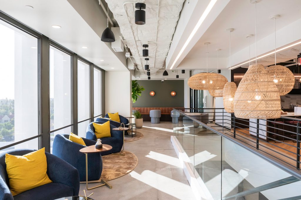 Floor-to-ceiling windows fill the common areas and private offices of Industrious Pasarroyo with soft, natural light.