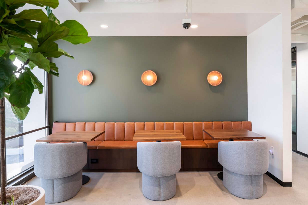 Earthy tones and ample greenery make for a warm and inviting lunch spot.