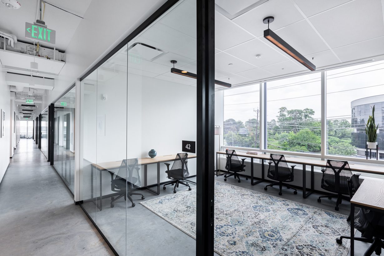Offices come equipped with oak desks and Herman Miller chairs.