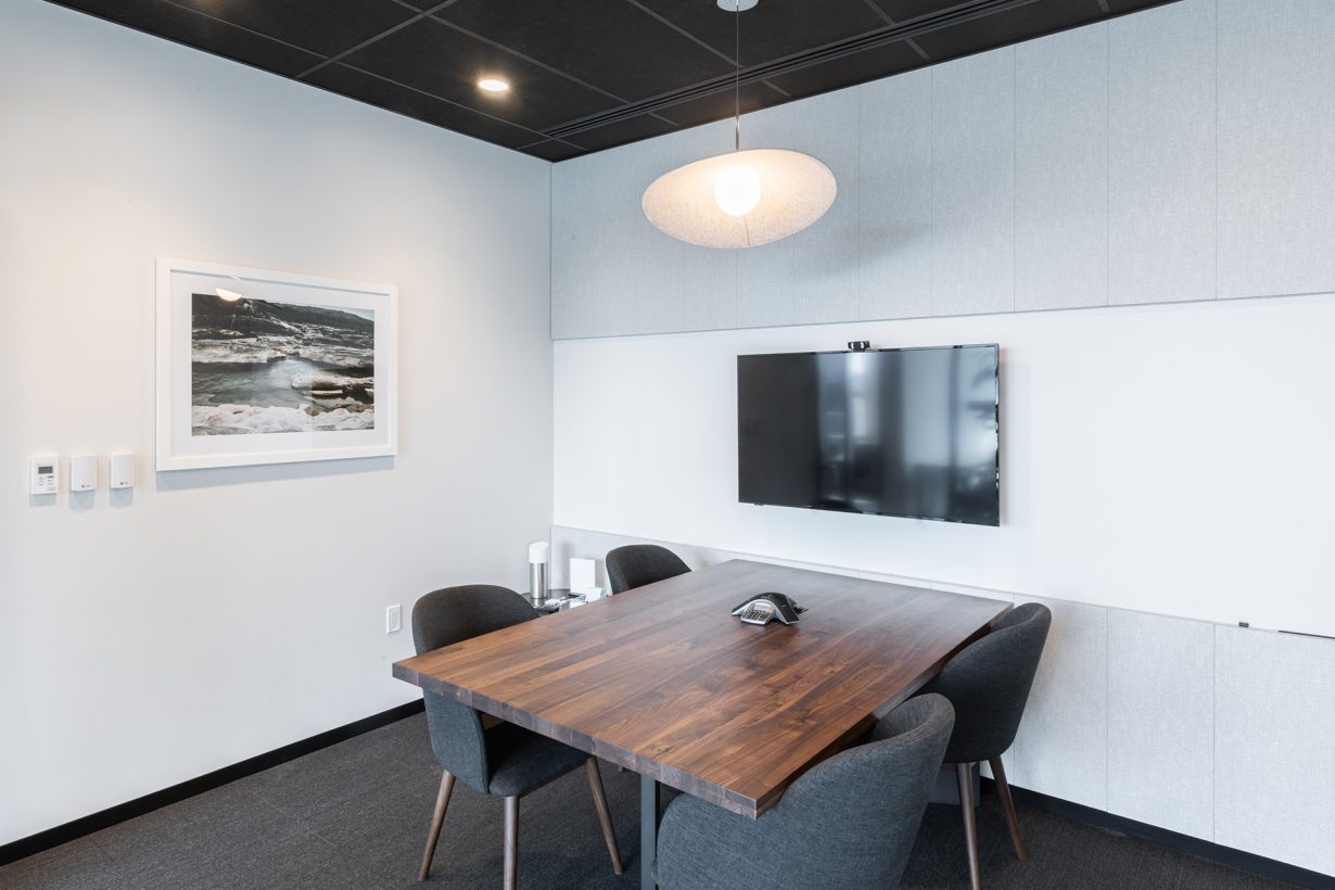 This small room has A/V equipment for collaborating with in-person and remote colleagues simultaneously.