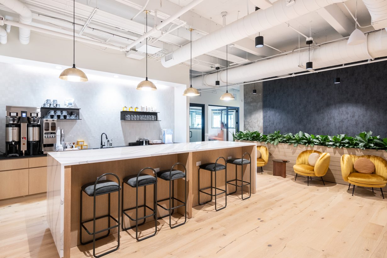 The cafe and kitchen, where members can grab coffee and breakfast in the morning.