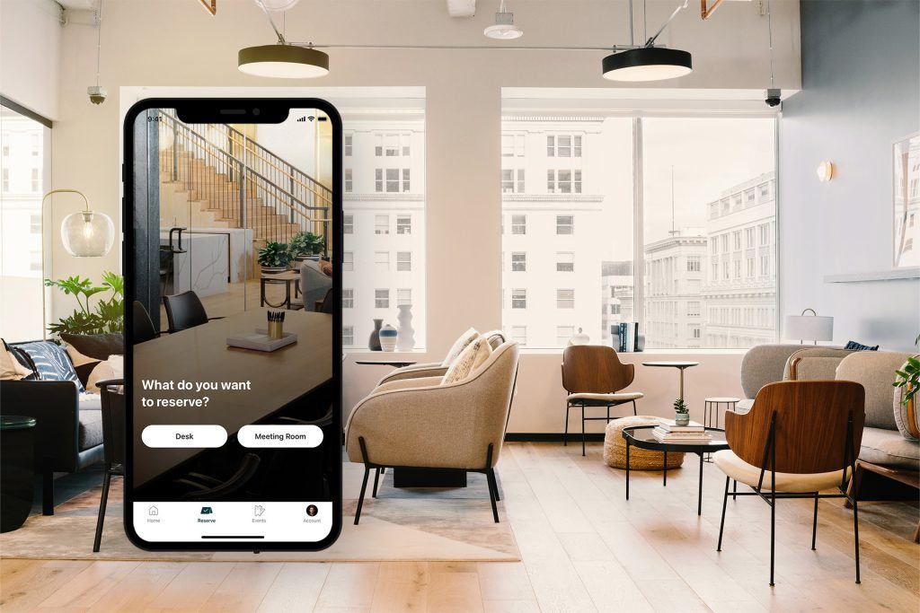 Header image showing the industrious mobile app screen, with options to book a meeting room or desk, juxtaposed with an industrious office space in the background.