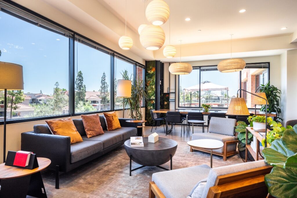 A warm and inviting lounge at Industrious Old Town, an all-inclusive workplace offering virtual office space in phoenix, as well as solutions for coworking, offices, and meetings.