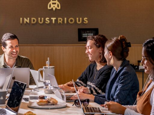 team working around a table at an Industrious office
