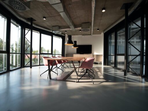 Contemporary flex office space featuring large windows and open layout